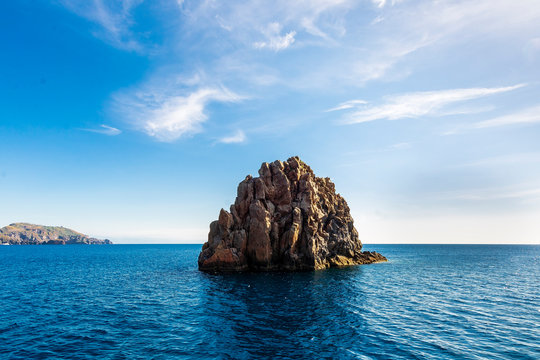 beutiful view at amazing lonely beautiful rocks and picturecque blue sky by the sea , mediterranean landscape, throne of Eol