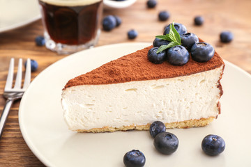 Tasty cake with blueberry on plate, closeup
