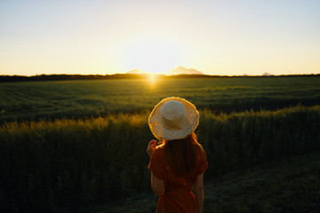 woman in hat on background of blue sky