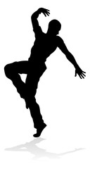 A male street dance hip hop dancer in silhouette