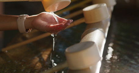 Fototapeta na wymiar Wash hand before enter japanese temple