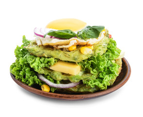 Stack of tasty squash waffles with fried egg on white background