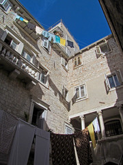 Cityscape at the Old Town in Split, Croatia. View of old European touristic downtown near the Diocletian’s palace on a sunny day.