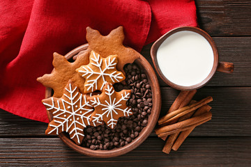 Tasty Christmas cookies and jug of milk on table