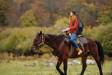 young woman riding horse