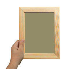 Male hand holding a wooden frame isolated on white background.