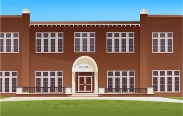 School building and empty front yard with grass