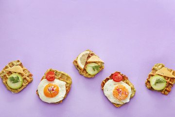 Different squash waffles on color background