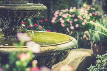 Closeup fountain in the garden. retro tone.  