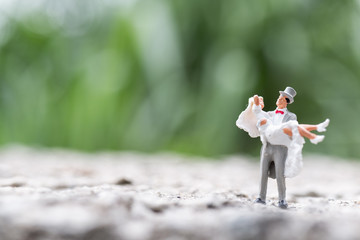 Miniature people : Bride and groom couple standing outdoor