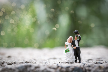 Miniature people : Bride and groom couple standing outdoor