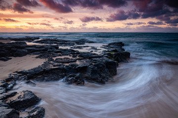 flowing water on the shore of Maui , long exposed