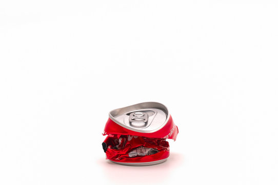 Compressed cans before discarding to help increase the area of waste disposal.