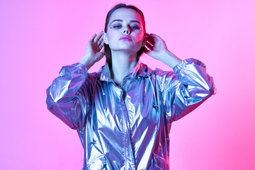 young beautiful woman with perfect skin in neon lights