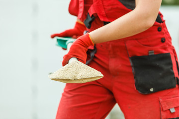Person using shovel on construction site