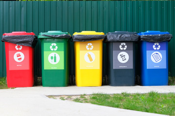Separate garbage collection. Waste recycling concept. Containers for metal, glass, paper, organics,...