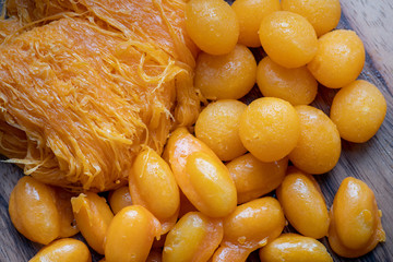 Close up of famous Thai dessert, Thongyod or sweety gloden drop or egg yoke fudge balls, Foythong...