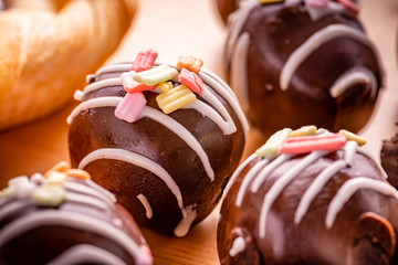 chocolate ball with topping on wooden background