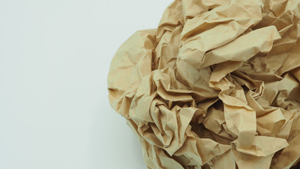 Crumpled brown paper.It is mauled on white blackground.