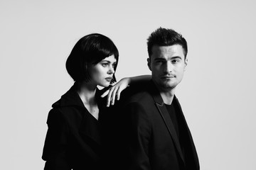 portrait of man and woman on white background