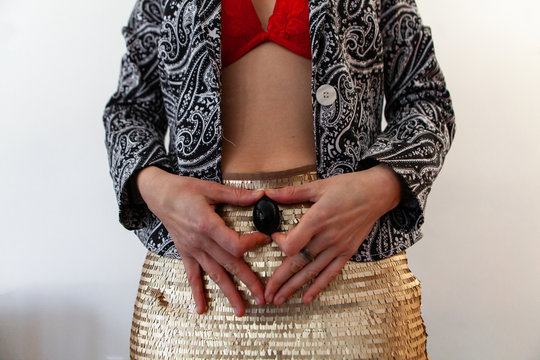 Beautiful young woman holds jade egg. A yoni egg is viewed close-up in the hands of a young lady, used to promote sexual health and well-being in women, taoist practices.