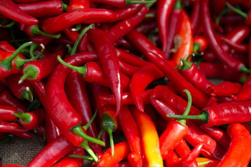 Red hot fresh raw chili peppers in outdoor market