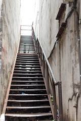 Fototapeta premium rusty metal stairs, rusty iron steps and handrails