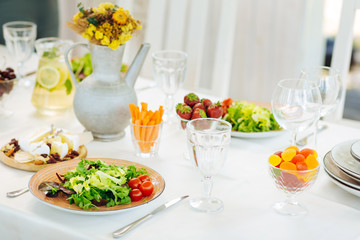 Healthy appetizers and desserts serving on the veranda