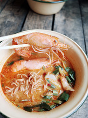Spicy Noodle with Big Shrimps in Bowl or 'TOM YAM KUNG' Local Street Thai Food                                                                