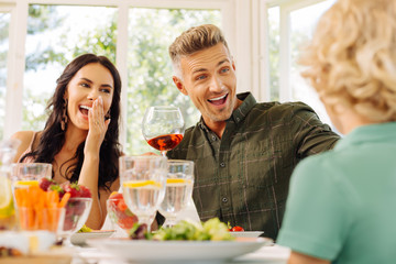 Parents feeling surprised while listening to their cute son