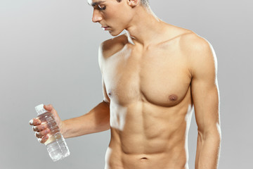 young man with bottle of water