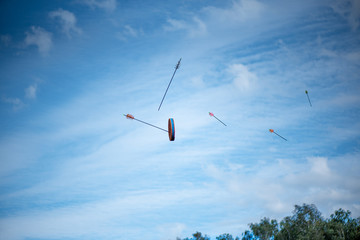 Arrows flying at the target, on blue sky background