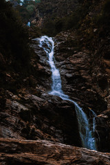 Fototapeta na wymiar Waterfall in the mountains as seen on the way to Kedarnath Temple in Uttarakhand, India