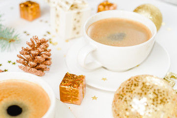 cup of hot coffee on a christmas holiday table. holidays and events consept.