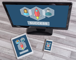 Business success concept on different devices