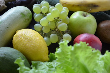 Healthy food clean eating selection: fruit, vegetable, seeds, superfood, cereal, leaf vegetable on...