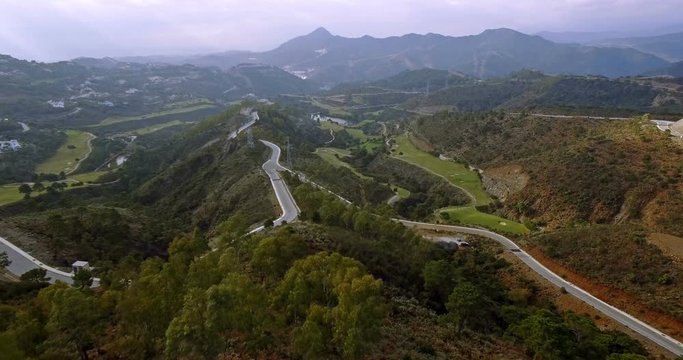 4K Aerial, View on golf course and hairpin bends, Andalusia, Spain