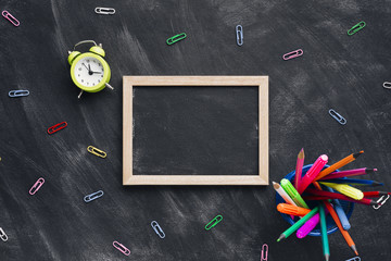 Chalkboard slate surrounded by stationery