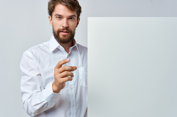 young businessman holding blank business card