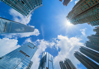 Looking up at modern office buildings. Financial district and business centers in smart city for...