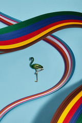 Closeup shot of breastpin in view of flamingo with green-colored feathers, isolated asymmetrically...