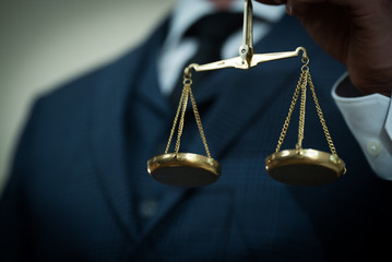 Lawyer businessman working or reading lawbook in office workplace for consultant lawyer concept.