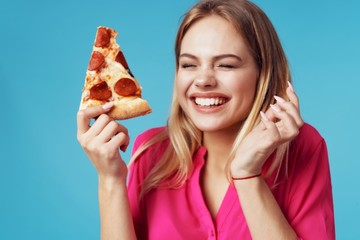 young woman eating pizza
