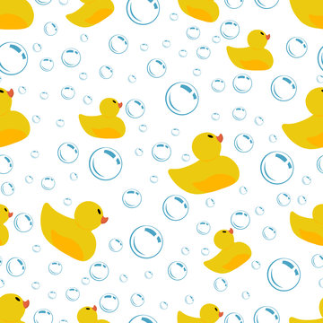 Seamless pattern with rubber ducks and bubbles on a white background