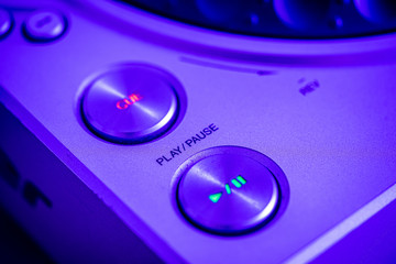 Closeup of Play, Pause and Cue buttons on a CD Player