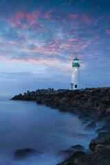 Santa Cruz Breakwater Light (Walton Lighthouse) in Santa Cruz at colorful sunrise, Pacific coast,...