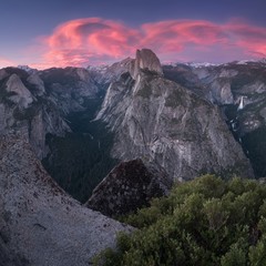 Half Dome and Yosemite Valley in Yosemite National Park during colorful sunrise with trees and...