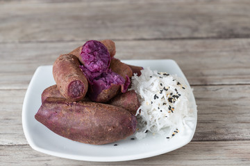 Steamed purple sweet potato in white plate
