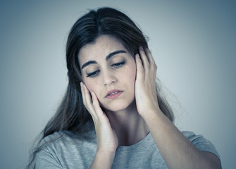 Portrait of sad and depressed woman. Isolated in white background. Human expressions and emotions