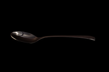 Spoon isolated on a black background